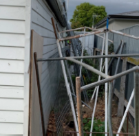 [Image] safety alert polarity testing poles and storage shed