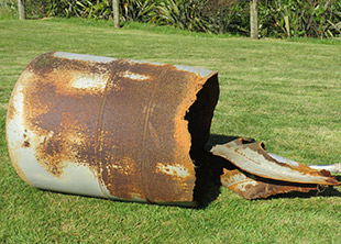 [image] damaged pressure cylinder lying on its side. 