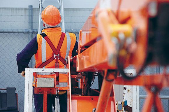 [image] A worker restrained in boom-style elevating work platform