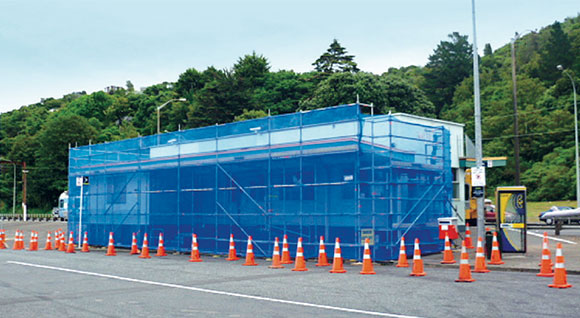 [image] Covered scaffolding on a single storey building