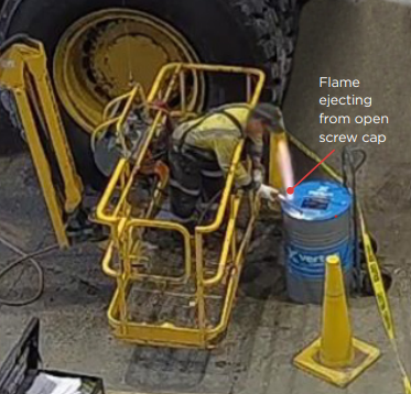 [Image] man beside oil drum with flame ejecting. 